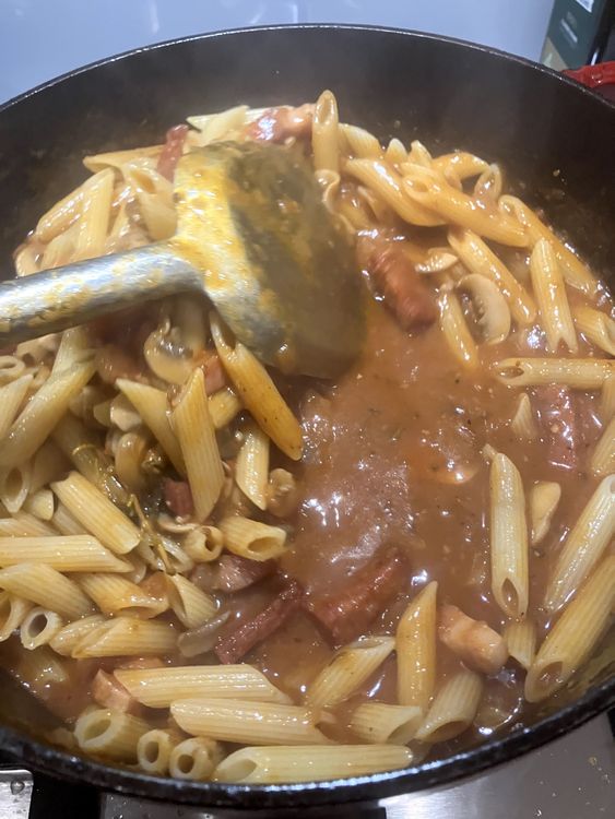 Step 4.4: Add pasta to the sauce along with 1/3 cup of pasta cooking water, Mix through until the sauce is covering the pasta and the meat and mushrooms are nicely incorporated