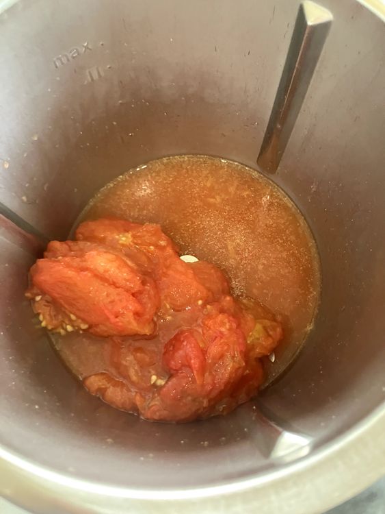 Step 1.3: Once finished roasting, set aside the garlic and peel all the tomatoes, discarding the skins