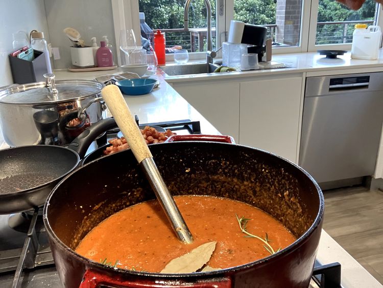 Step 2.5: Add the beef stock, white sugar and tomato puree, mixing everything together