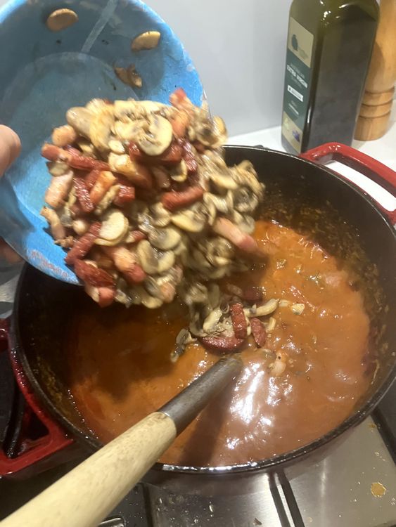 Step 2.1: Add salami, speck and mushrooms to the pot then mix and cook uncovered for another 30 minutes