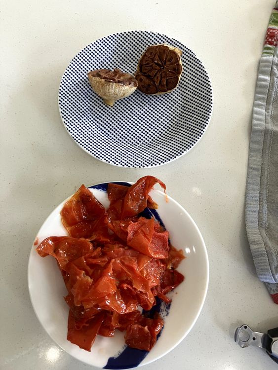 Step 1.2: Once finished roasting, set aside the garlic and peel all the tomatoes, discarding the skins
