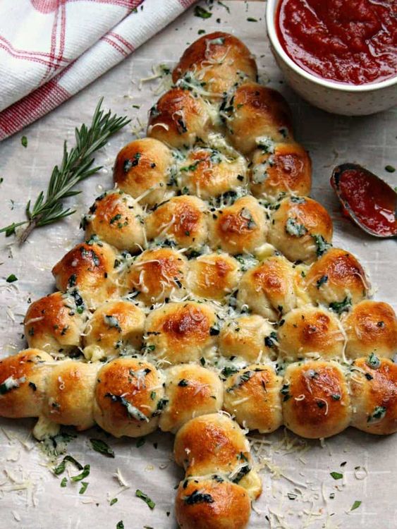 Step 3.1: When the bread is finished baking, remove from the oven and use a pastry brush to brush on the herb garlic butter then sprinkle with the rest of the parm cheese