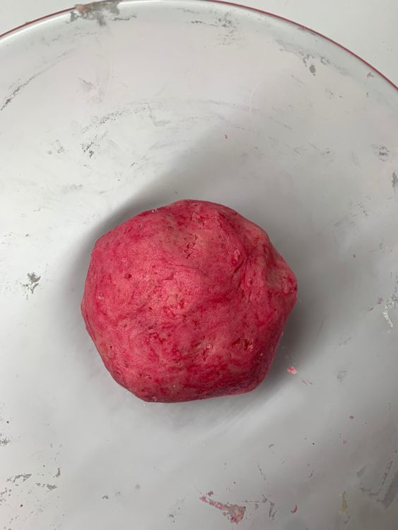 Step 1.1: Then add the flour mixture and mix well to form a smooth dough