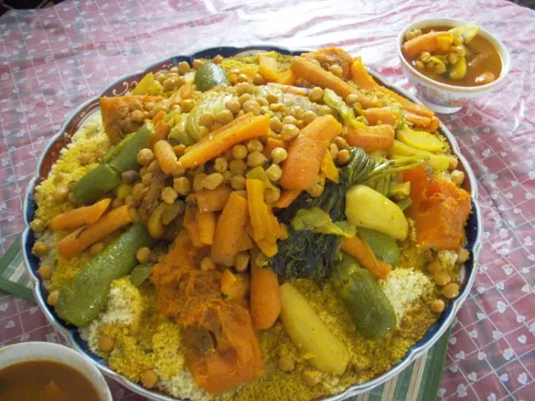 Step 4.1: To serve, place a generous portion of couscous on a plate, top with the chicken and vegetable mixture, and garnish with fresh cilantro or parsley