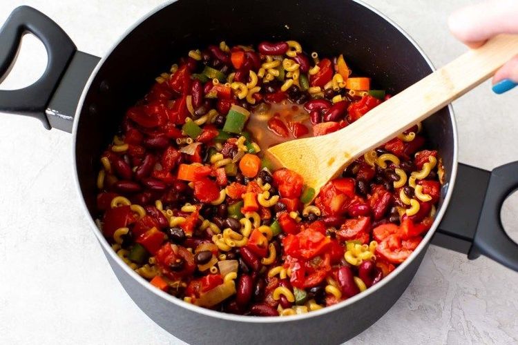Step 1.1: Stir in the diced tomatoes, diced tomatoes with green chilies, pasta, black beans, kidney beans, and water