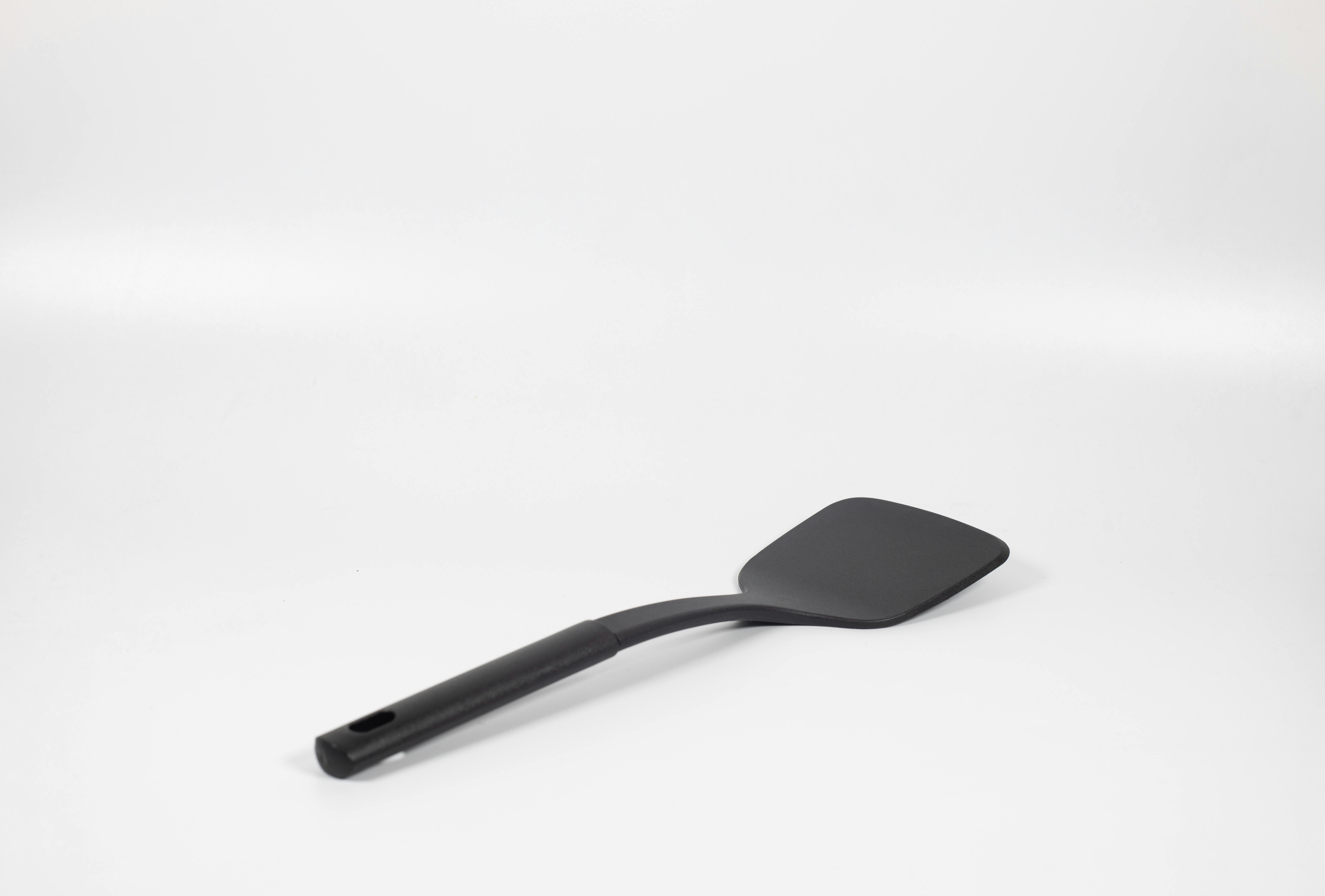 A black plastic spatula