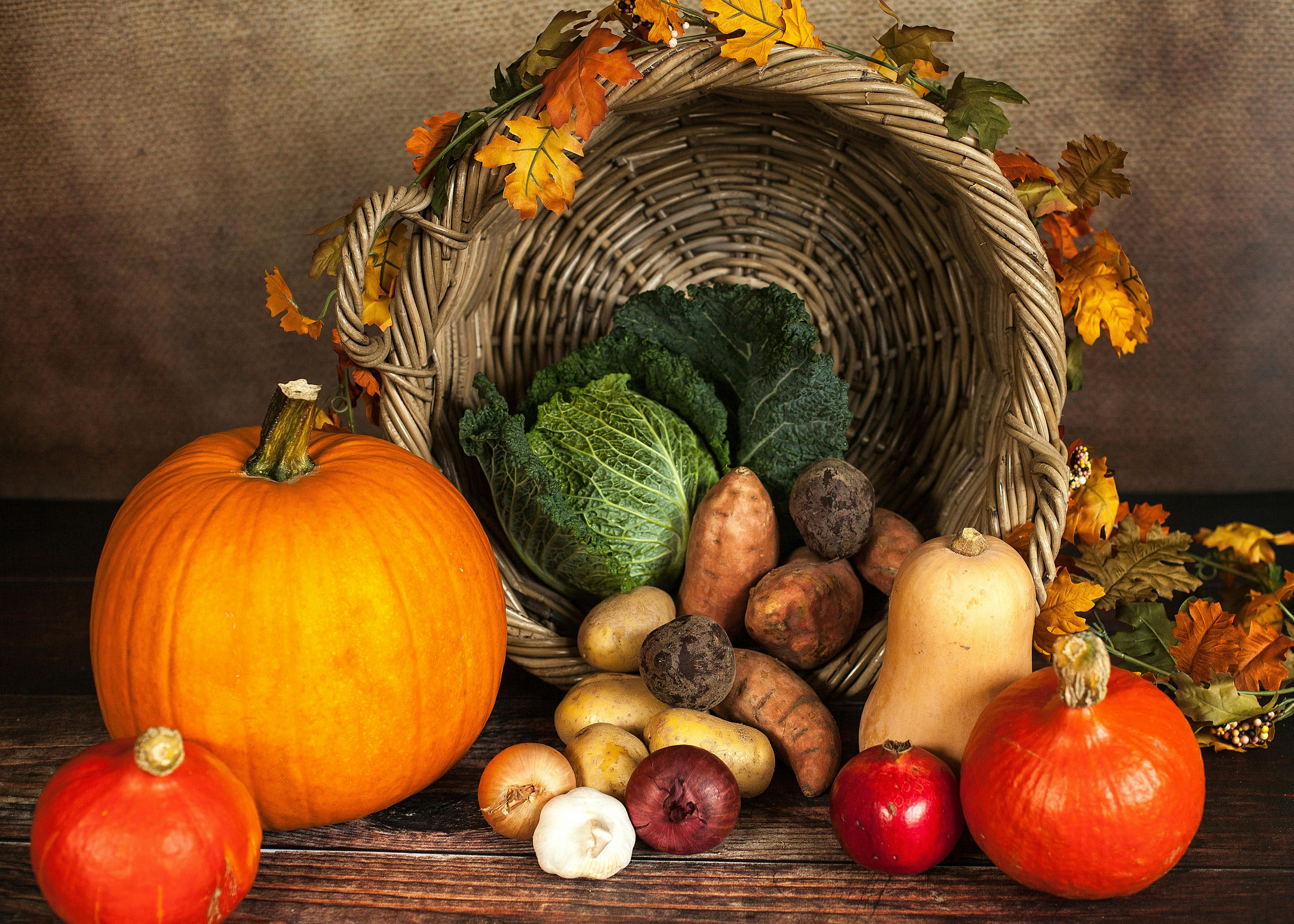 Organic vegetables falling out of a basket