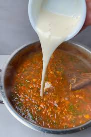 Step 1.1: Once the lentils and chickpeas are cooked, gradually stir in the flour-water mixture to thicken the soup