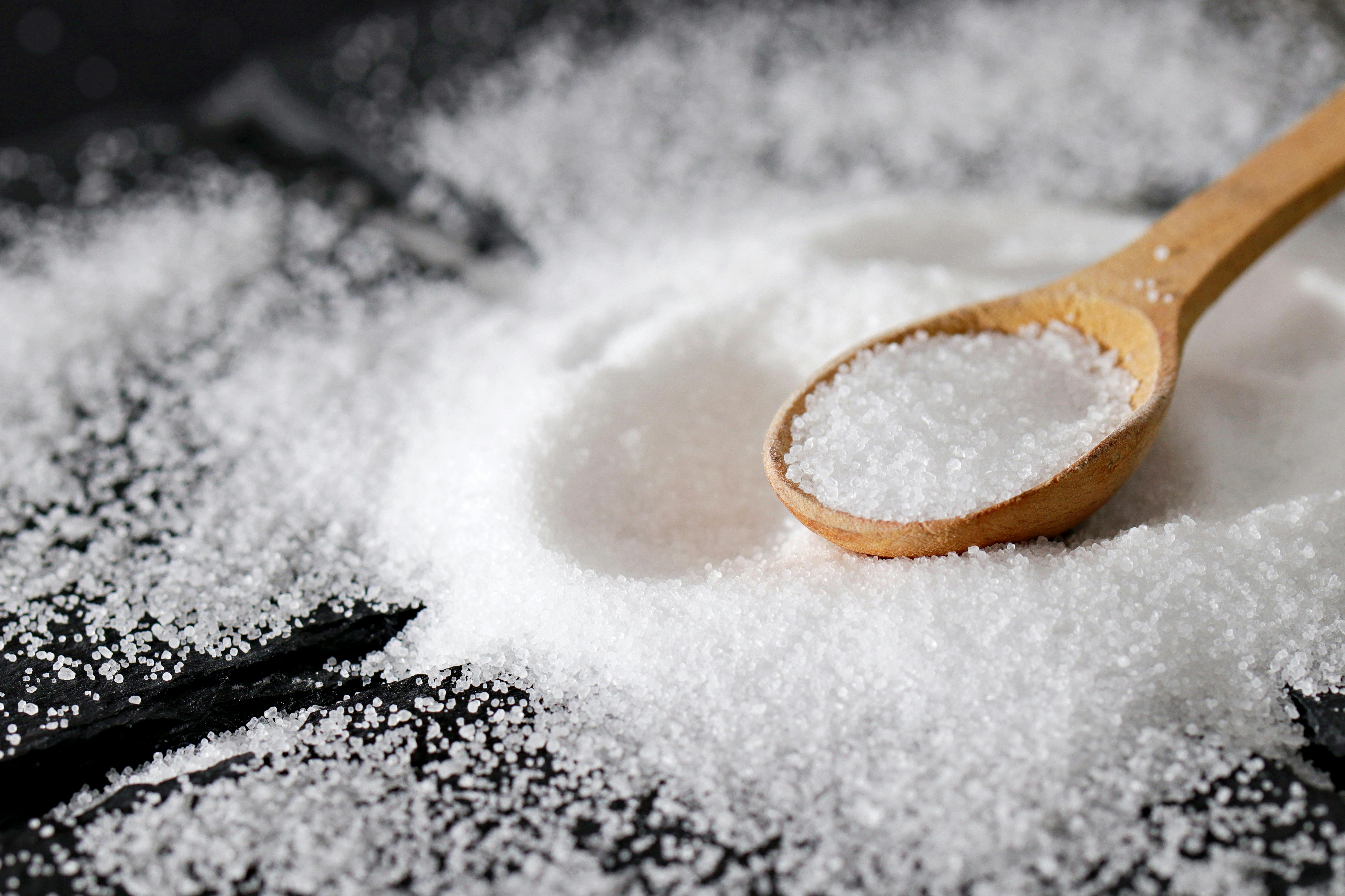 Close-Up Shot of a Wooden Spoon and Salt