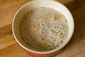 Step 1.1: In a small bowl, mix the warm water, sugar, and yeast