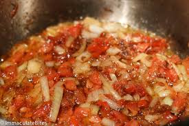 Step 1.1: Add the chopped tomato and cook until it softens