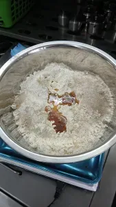 Step 1.1: In a large bowl, combine flour, salt, and sugar